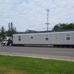 How far in advance should I schedule mobile home moving services?